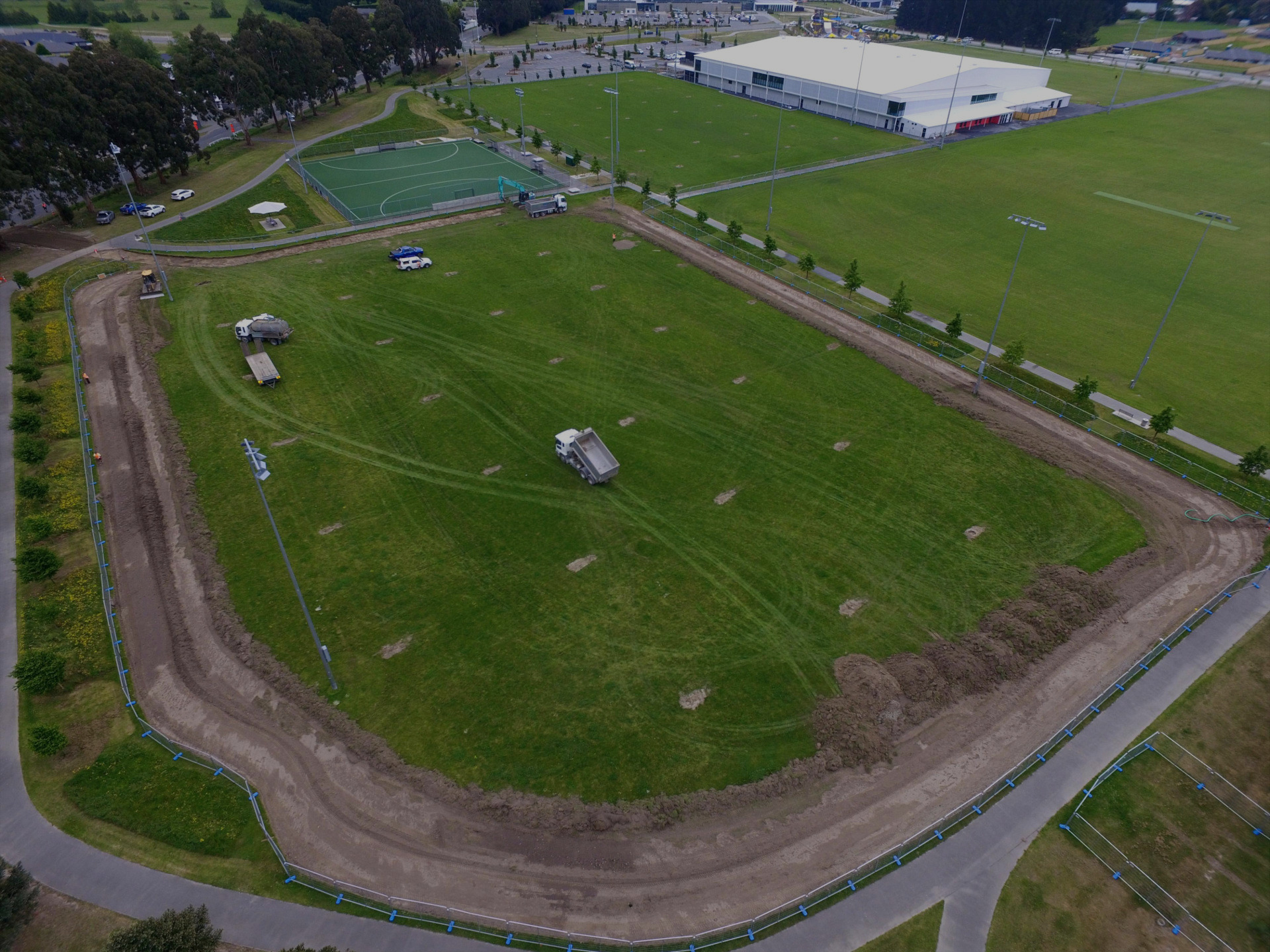 Aerial view of a Christchurch sports field under construction by EDR Contracting, with topsoil stripped to install irrigation systems, edging, and supporting civil infrastructure.